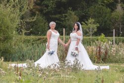 hanbury barns wedding photography LGBTQ+ gay lesbian brides holding hands